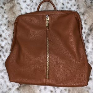 Tan and gold backpack